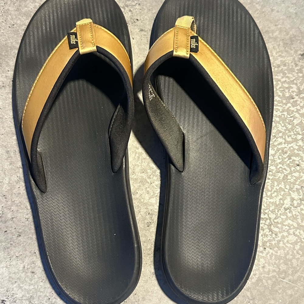 Nike Women’s Black and Gold Flip-Flops